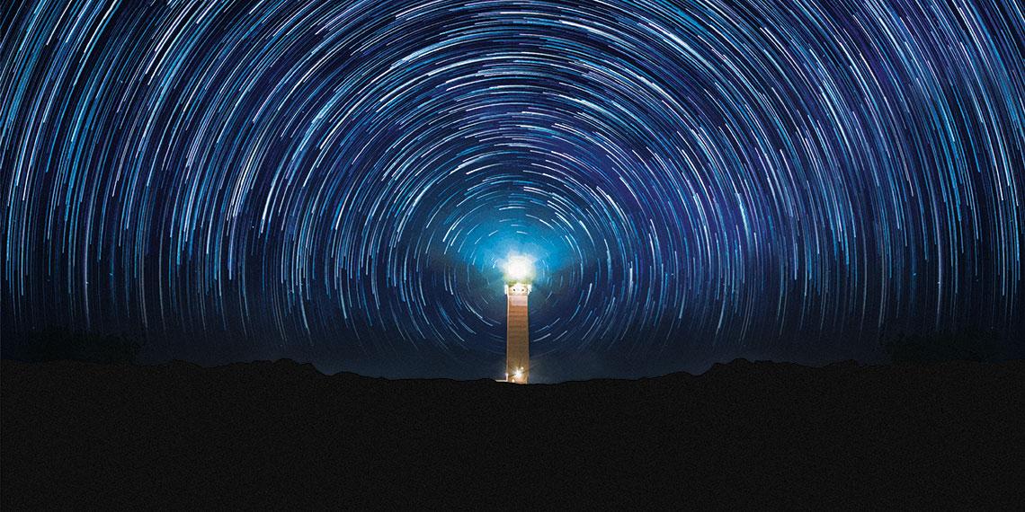 Lighthouse on starry night